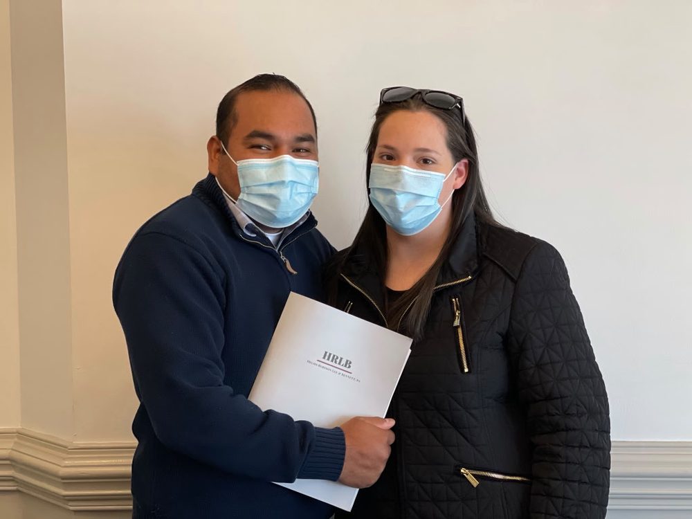 Couple holding their closing papers